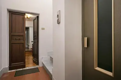 a hallway with a door and a stairway at Trevi Fountain Apartment in Rome