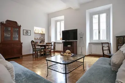 a living room with a couch and a table at Trevi Fountain Apartment in Rome