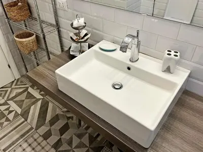 a bathroom with a white sink and a mirror at Casa Gioia - Metro Garbatella in Rome