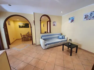 a living room with a couch and a table at A 2 passi dal cuore di Roma in Rome