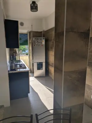 a kitchen with a refrigerator and a counter top at Roma centro appartamento per vacanze in Rome