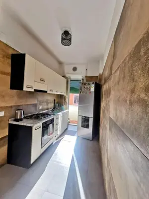 a kitchen with a stove and a refrigerator at Roma centro appartamento per vacanze in Rome