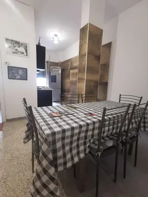 a dining room table with a checkered table cloth at Roma centro appartamento per vacanze in Rome
