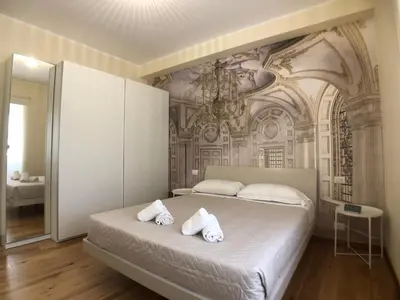 a bedroom with a bed with towels on it at Maison Carlotta In Vatican in Rome