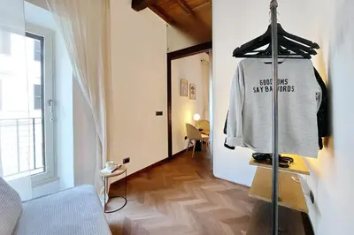 a room with a shirt hanging on a rack at YCH Elegant flat with terrace to Trastevere in Rome