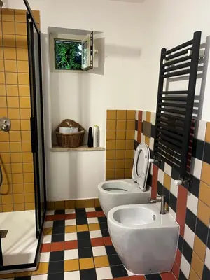a bathroom with a toilet and a sink at trastevere' s Musa in Rome