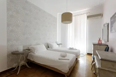 a bedroom with two beds and a table at 