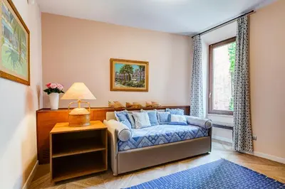 a bedroom with a bed and a window at BMGA l Luxury Home with Patio in Trastevere in Rome