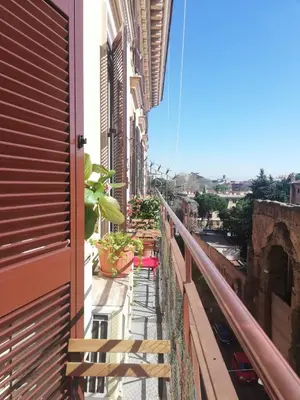 a balcony of a building with plants on it at Aria Rome Rooms in Rome