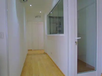 a hallway with a glass door and a hallway with a floor at Buonarroti Guest House in Rome