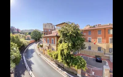 a view of a street in a city with buildings at Charming mini apartment near Vatican with parking in Rome