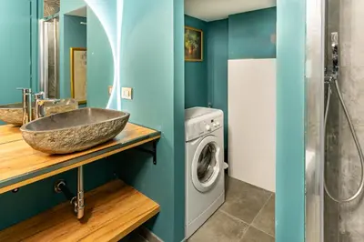 a bathroom with two sinks and a large stone sink at LOFT49 in Rome