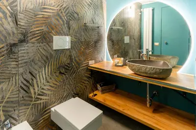 a bathroom with a sink and a mirror at LOFT49 in Rome