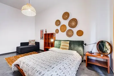 a bedroom with a bed and a couch in a room at Termini Sweet Home in Rome