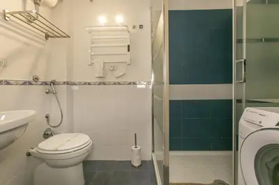 a small bathroom with a toilet and a shower at Pantheon Palazzo Nari #9 in Rome