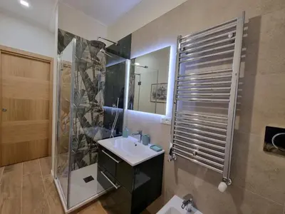 a bathroom with a sink and a shower at A casa di Marisa in Rome