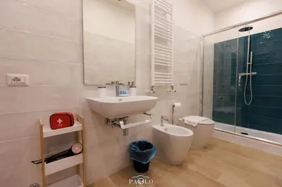 a bathroom with a sink and a toilet and a shower at Domus Degli Dei in Rome