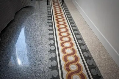 a long line of circles on the floor of a hallway at Saint Peter's Keys in Rome