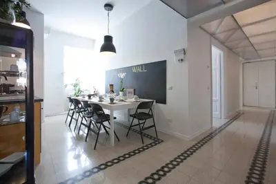 a dining room with a white table and chairs at Saint Peter's Keys in Rome