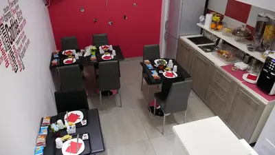 an overhead view of a restaurant with tables and chairs at Tiburtina Royal Suites in Rome