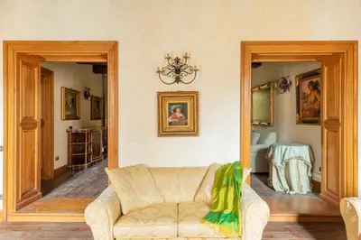 a living room with a couch and a mirror at iFlat Golden Gem in Trevi in Rome