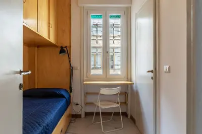 a small room with a bed and a window at GuestHost - Sapienza & Villa Borghese Comfy Apartment in Rome
