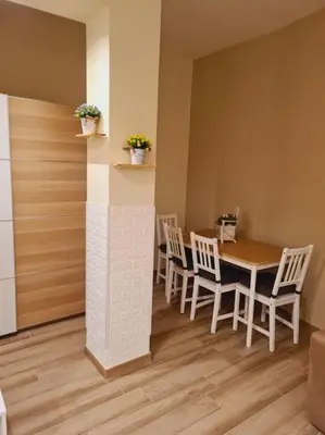 a dining room with a table and chairs at Casa Sorelle Marchisio in Rome