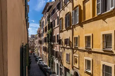 a view of an alley between two buildings at Appartamento centro storico BACCINAHOME in Rome