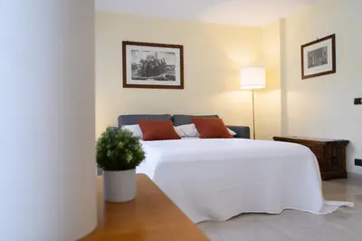 a living room with a couch and a table at La Dimora del Vagamondo - ingresso in comune in Rome