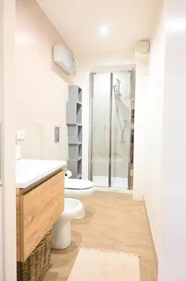 a bedroom with yellow walls and a white closet at Casa Pesa 2 rooms 2 baths Rome center in Rome