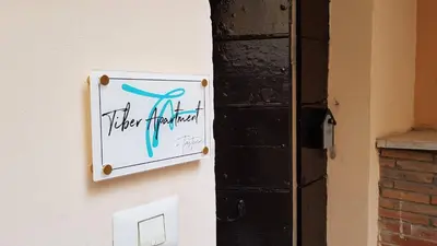 a sign on the side of a building with the words their pharmacy at Tiber Apartment in Trastevere in Rome
