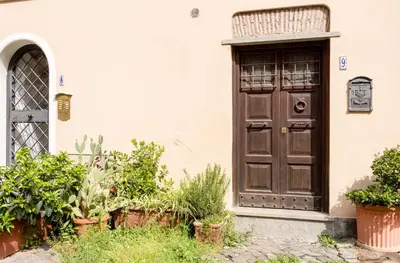 a door of a house with plants in front of it at VII Coorte a Trastevere in Rome
