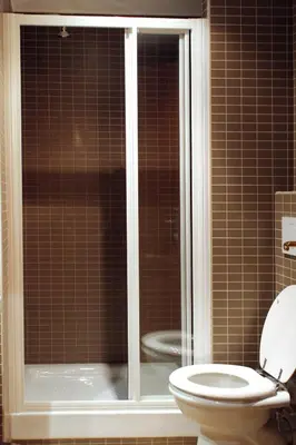 a bathroom with a shower and a toilet in it at Funny Holiday in Rome