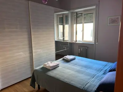 a bedroom with a bed with two towels on it at Un piacevole alloggio turistico in Rome