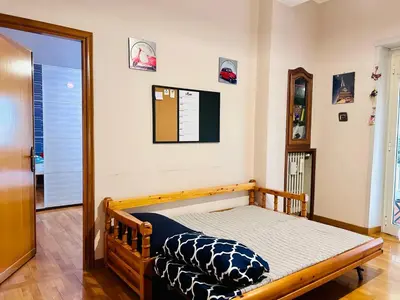 a bedroom with a bed in a room at Un piacevole alloggio turistico in Rome