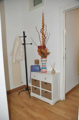 a room with a plant in a vase on a table at Mary's House in Rome