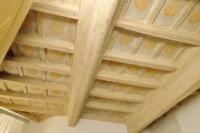 a ceiling in a building with a wooden ceiling at suity I cozy coronari apartment in Rome