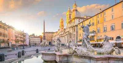 a fountain in the middle of a city with buildings at PANTHEON allo SCRIGNO in Rome