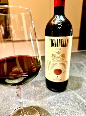 a bottle of wine next to a glass of wine at Buonarroti Art Home - Luxury and Art in Rome in Rome