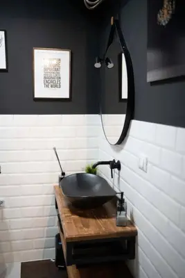 a bathroom with a black sink and a mirror at Loft stupendo nel cuore di Trastevere AcasadiCri in Rome