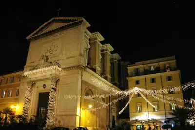 a building with christmas lights in front of it at coronari apartments 2 in Rome