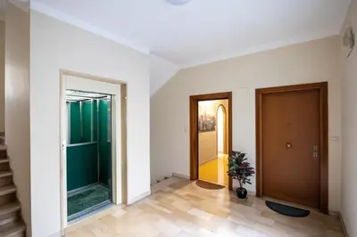 an empty hallway with a door and a window at Big Apartment Rome Air Conditioning WIFI Netflix 90 MQ in Rome