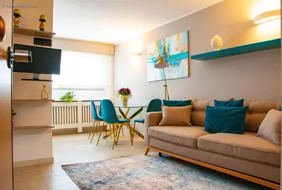 a living room with a couch and a table at Algima Flat Roma Ponte Milvio in Rome