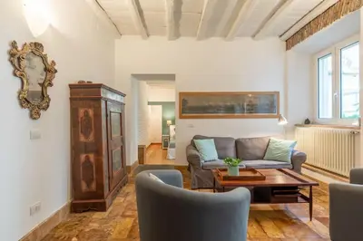 a living room with a couch and a table at Trastevere Lovely Apartment in Rome