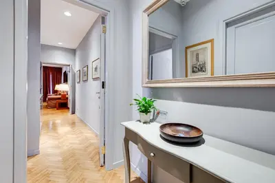 a kitchen with a counter and a mirror on the wall at Rome Frattina27 in Rome