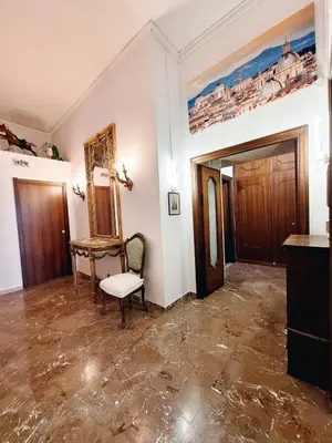 an empty room with a chair and a mirror at Pensiero Romano in Rome