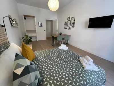 a living room with a couch and a table at Appartamento Millelire in Rome