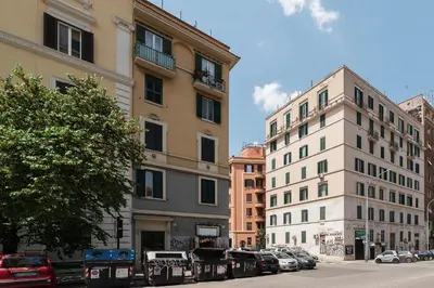 a city street with buildings and cars parked on the street at GuestHost - Functional Apartment Piazza Re di Roma in Rome