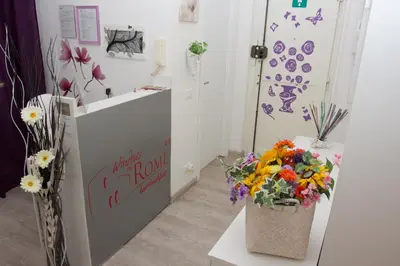 a flower shop with flowers in a room at Windows on Rome in Rome