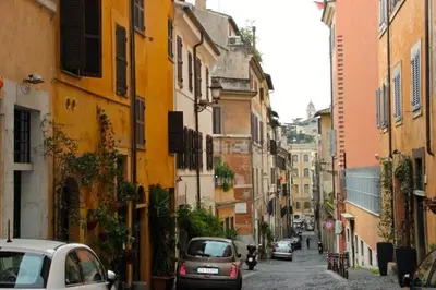 a city street with cars driving down a street at Monti apartment BDB in Rome